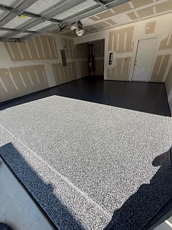 Concrete floor coating application in progress