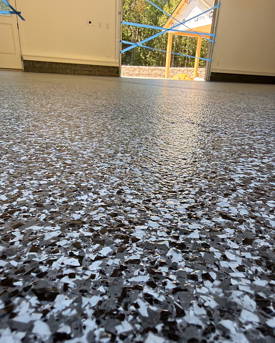 Decorative flake concrete floor coating with durable textured finish

