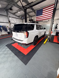 Custom red, black and gray Swisstrax garage flooring installation