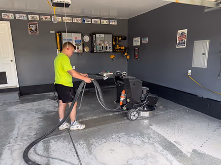 Professional concrete floor coating installation in progress