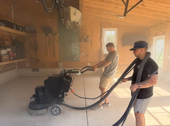 Diamond grinding concrete garage floor for coating preparation
